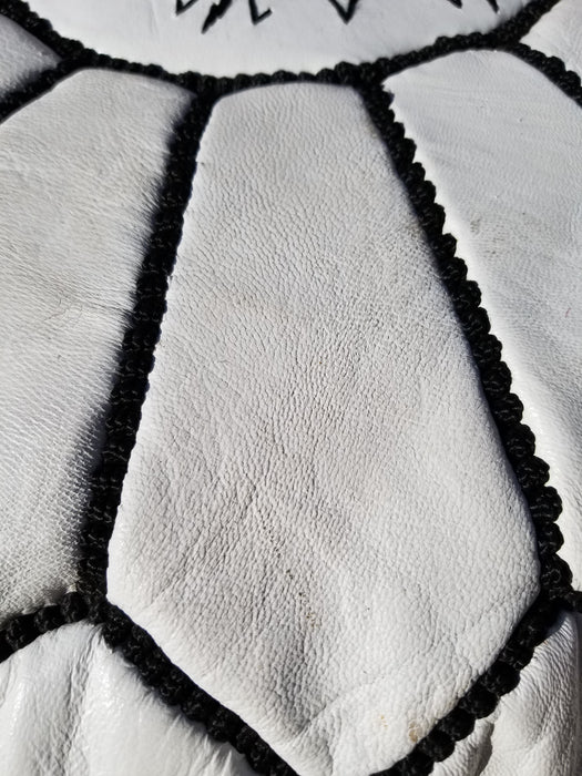 White and black Moroccan leather pouf